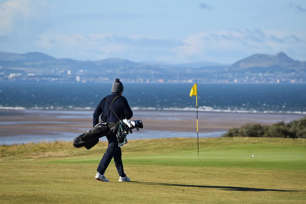 Gullane 1st tee with Edinburgh in background